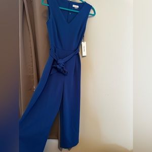 Blue jumpsuit with tie waist and pockets